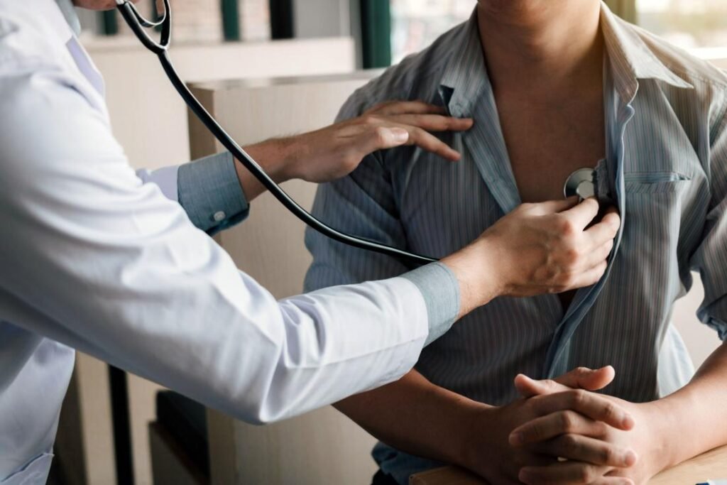 Doctor performing a physical examination on a patient with a stethoscope